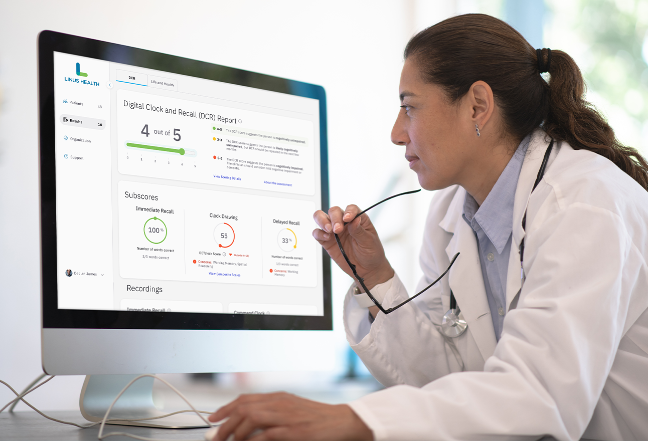 Primary Care Provider examining results from a digital cognitive assessment. Modern cognitive testing provides greater insights into a patients cognitive function