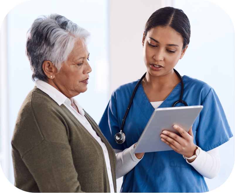 Medical Assistant or a Nurse Practitioner discusses the results of a Digital Cognitive Assessment with a patient. Modern cognitive testing delivers greater insights into a patient's cognitive function and detects early signs of Alzheimers and other dementias. Earlier detection of cognitive impairment gives providers the ability to apply interventions and recommend treatment options  