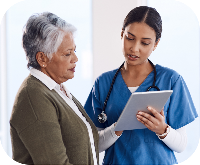 Medical Assistant or a Nurse Practitioner discusses the results of a Digital Cognitive Assessment with a patient. Modern cognitive testing delivers greater insights into a patient's cognitive function and detects early signs of Alzheimers and other dementias. Earlier detection of cognitive impairment gives providers the ability to apply interventions and recommend treatment options