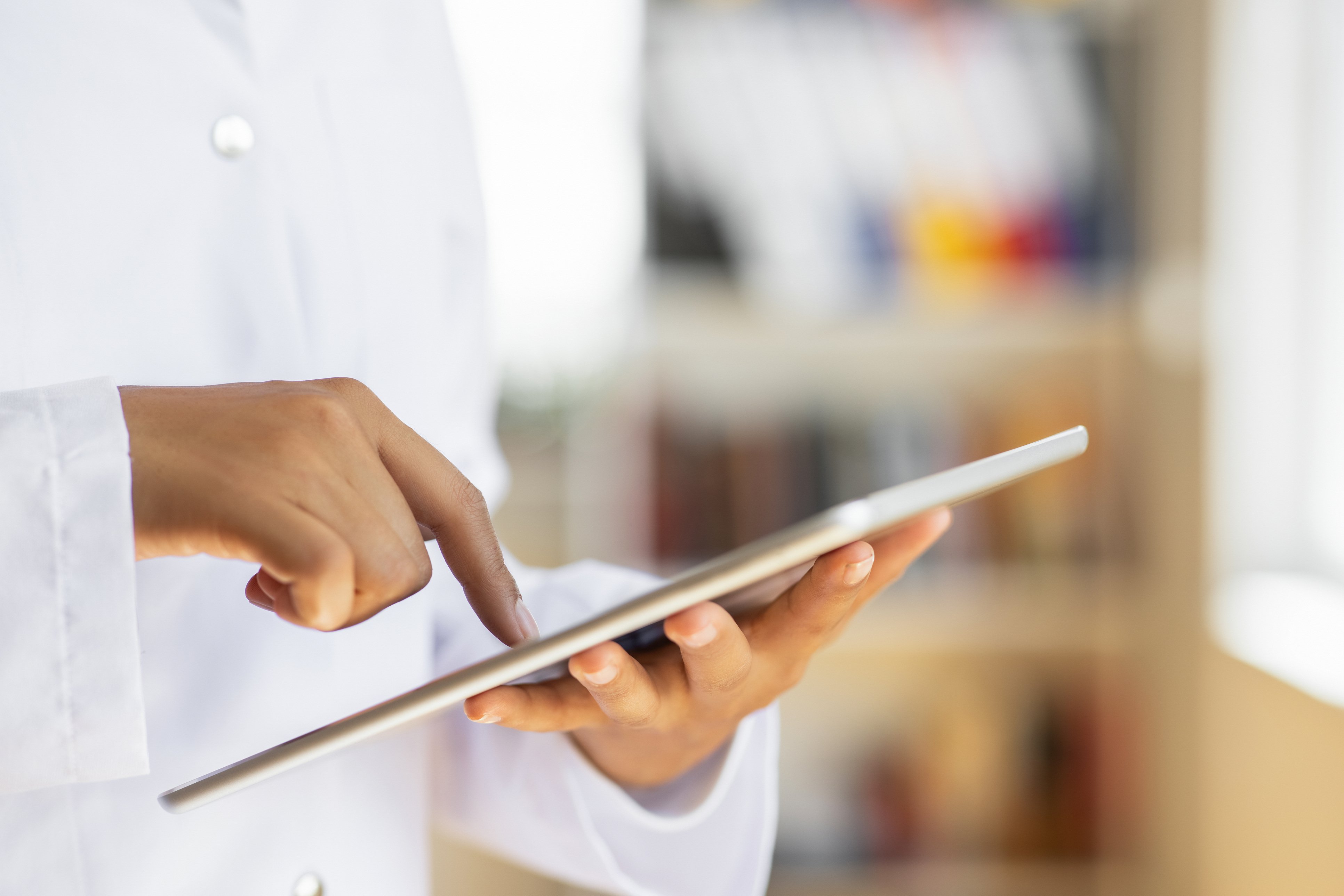 Female doctor using digital tablet