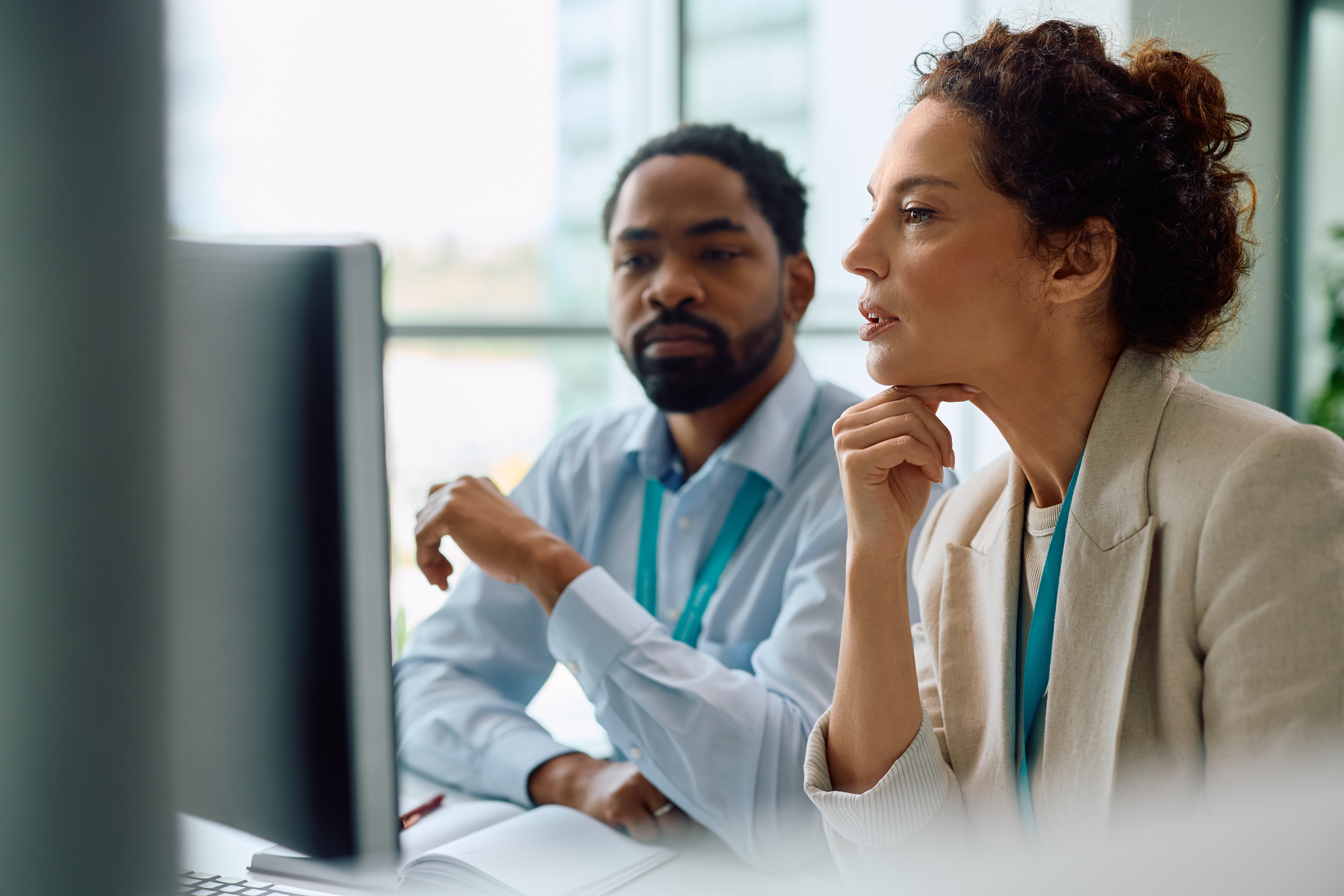 Healthcare executives working on computer in the office
